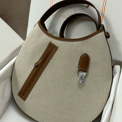P’TIT ARÇON BAG IN CANVAS & LEATHER HERMÈS