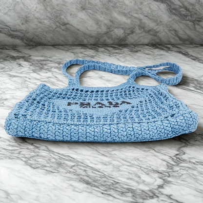 PRADA SHOPPER BAG IN RAFFIA WITH WOVEN LOGO – BLUE