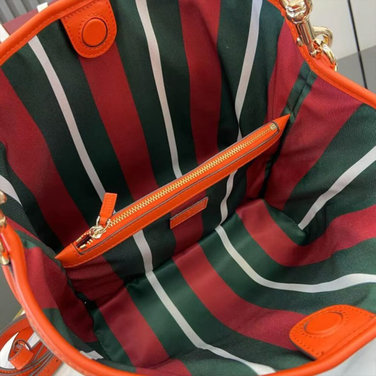 MEDIUM GG EMBLEM BUCKET BAG GUCCI
