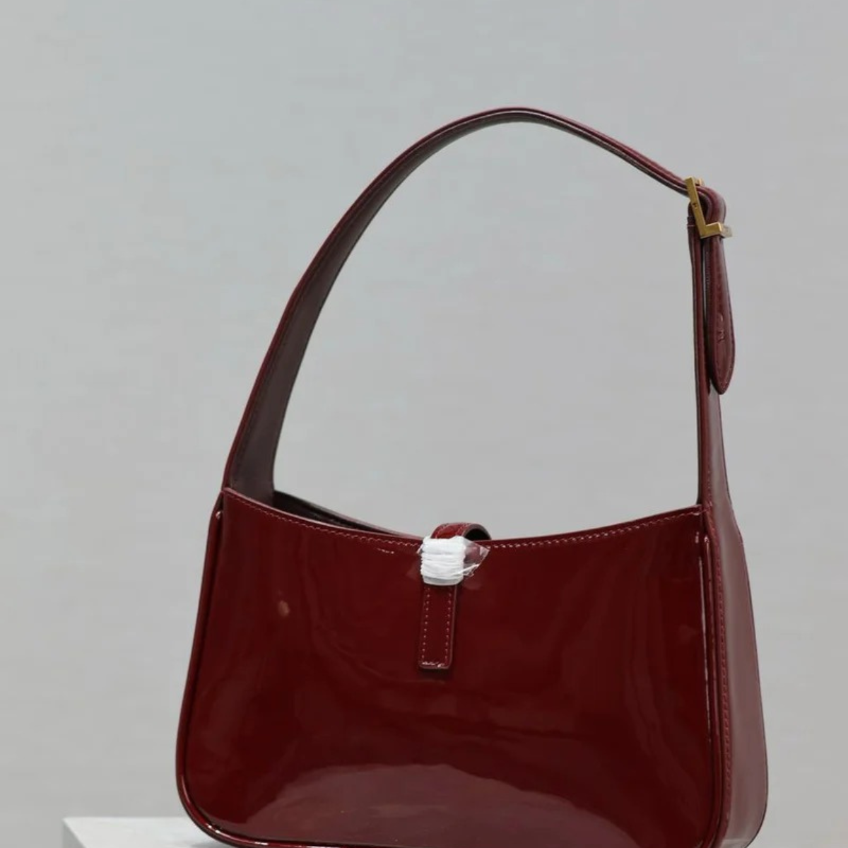 YVES SAINT LAURENT LE 5 À 7 BAG IN PATENT LEATHER